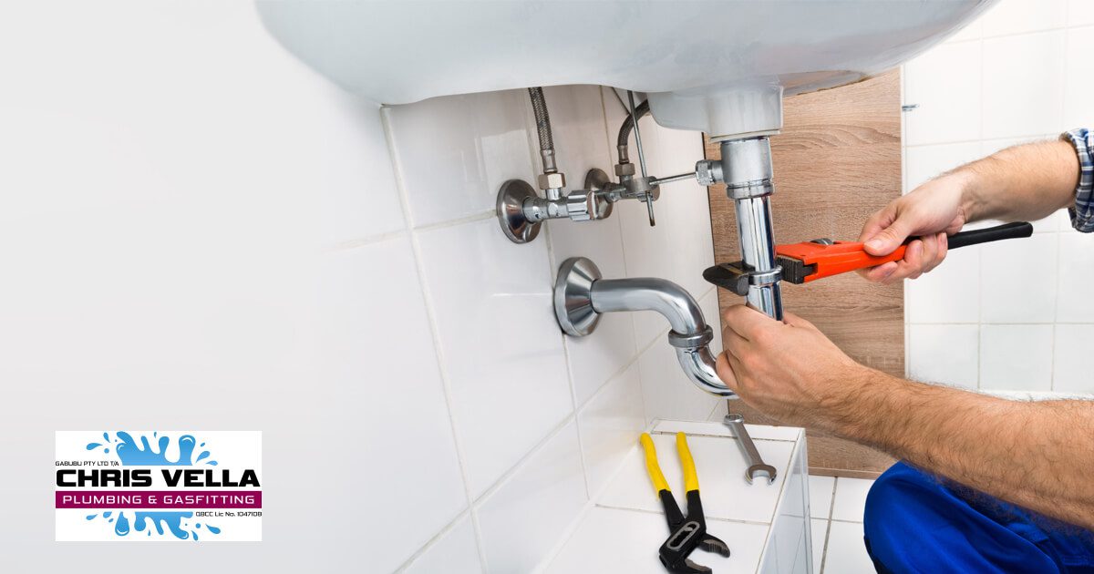Plumber fixing the sink Drain pink - Chris Vella Plumbing & Gasfitting